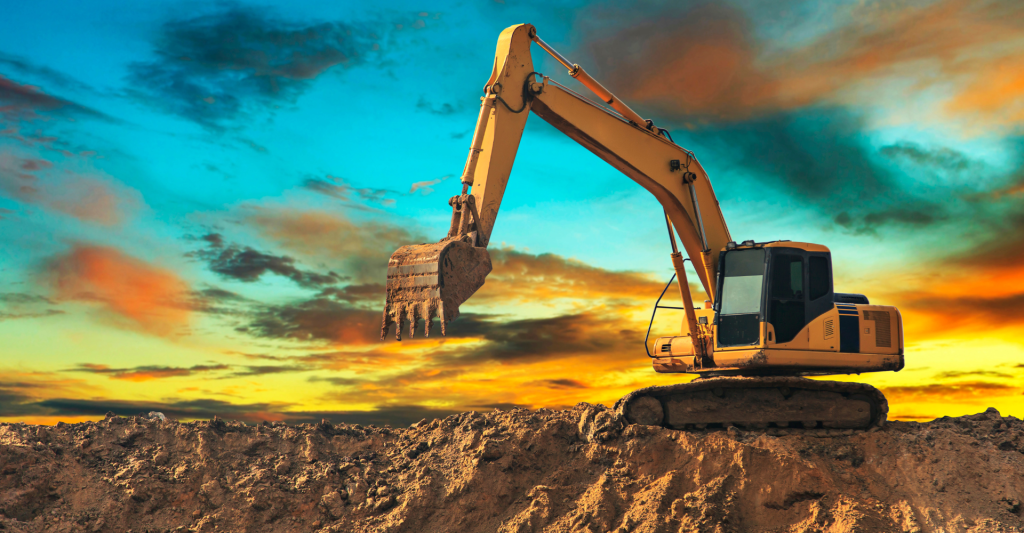 Excavator with a sunrise