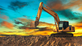 Excavator with a sunrise